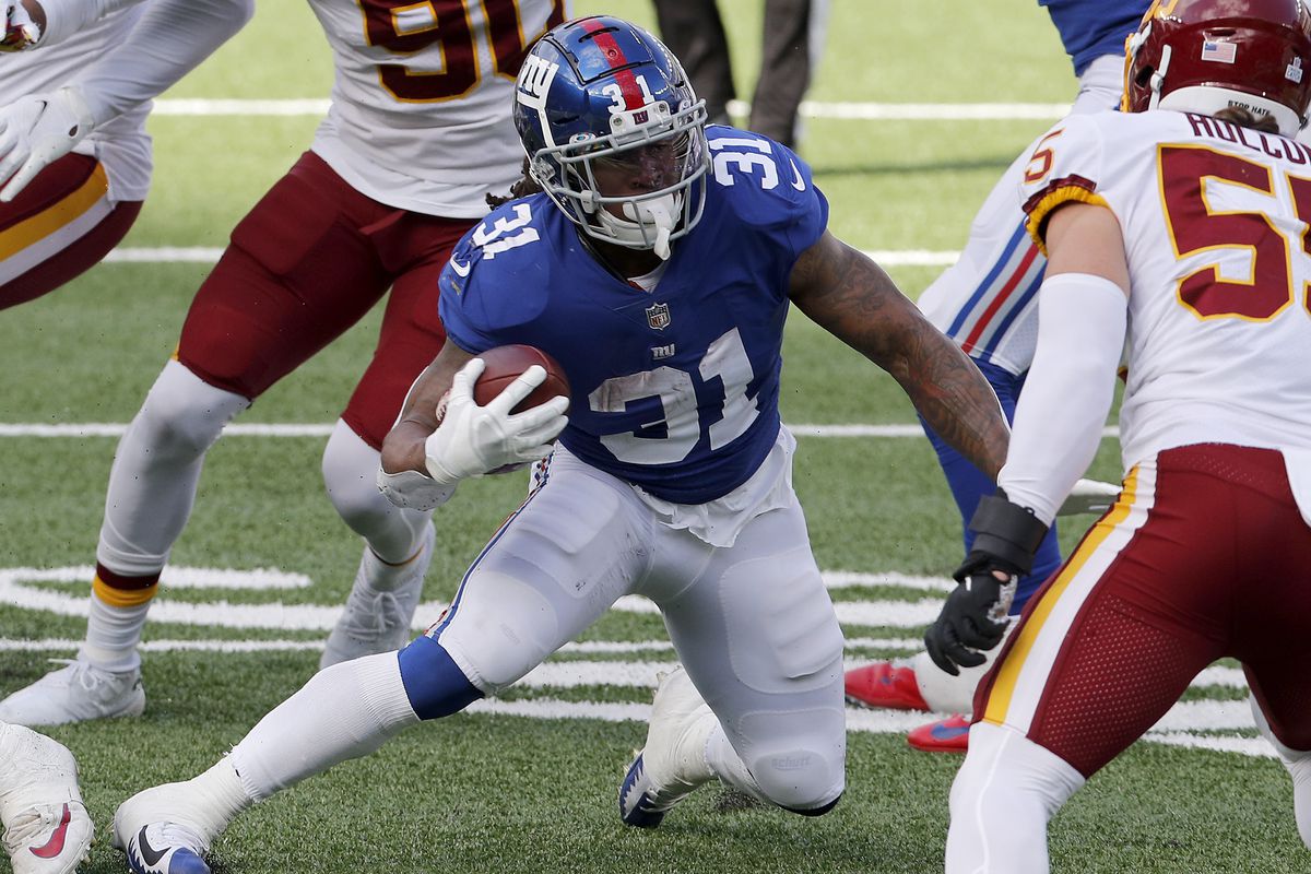 Devonta Freeman #31 of the New York Giants in action against the Washington Football Team at MetLife Stadium on October 18, 2020 in East Rutherford, New Jersey. The Giants defeated Washington 20-19.