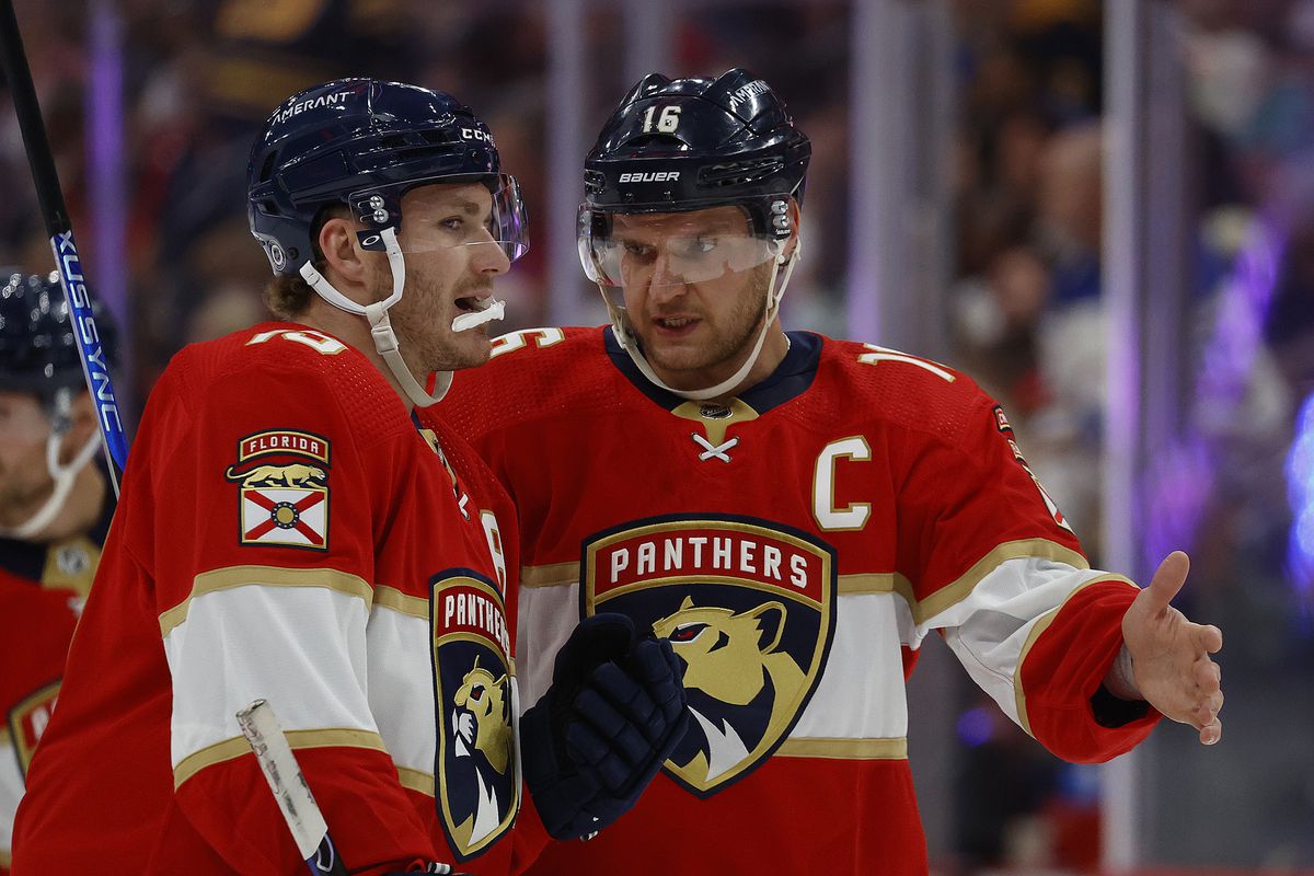 Aleksander Barkov and Matthew Tkachuk of the Florida Panthers chat before a face off against the Buffalo Sabres at the FLA Live Arena on April 4, 2023 in Sunrise, Florida.