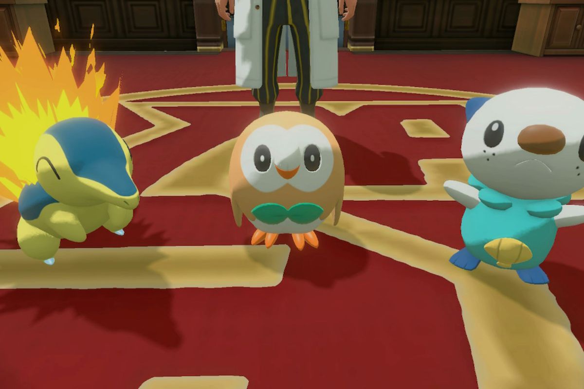 Rowlet, Cyndaquil, and Oshawott on some red and gold carpeting