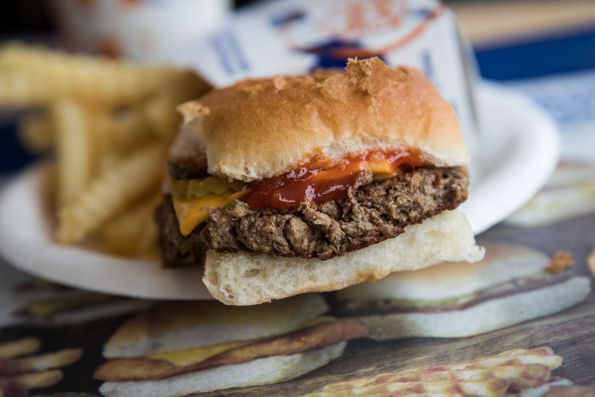 a white castle impossible slider on a tray with fries