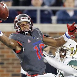 This photo taken Nov. 19, 2016, shows SMU wide receiver Courtland Sutton (16) unable to catch a pass as South Florida defensive back Jalen Spencer (30) defends during the second half of an NCAA college football game in Dallas.  Sutton was named to the second team AP Preseason All-America Team on Tuesday, Aug. 22, 2017. 