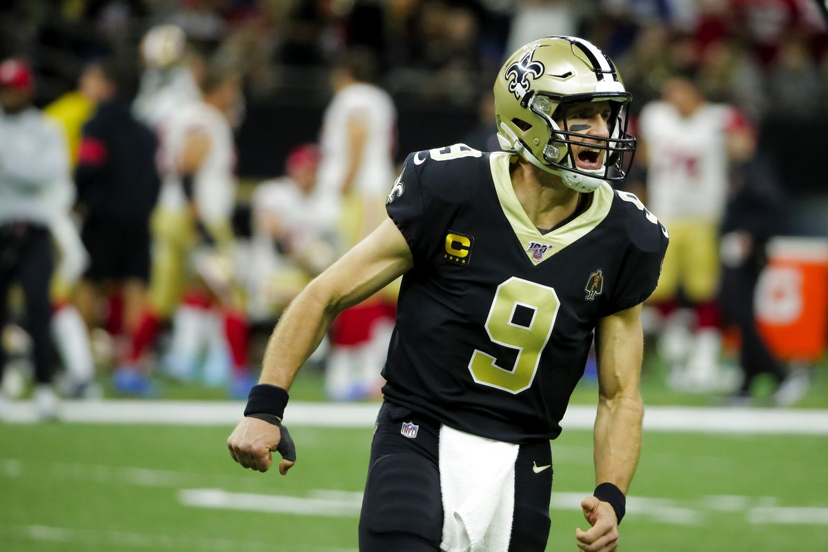 New Orleans Saints quarterback Drew Brees celebrates after a touchdown pass to tight end Jared Cook (not pictured) during the first quarter against the San Francisco 49ers at the Mercedes-Benz Superdome
