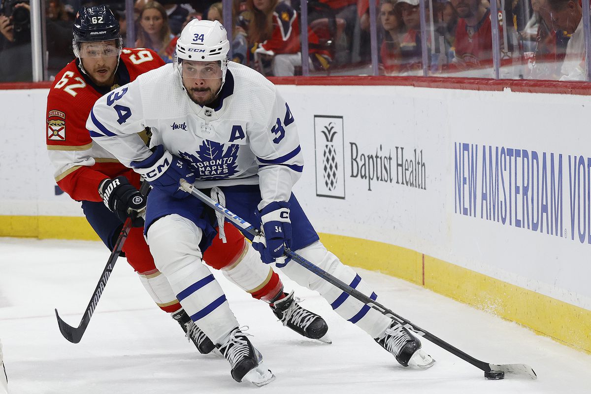 Auston Matthews of the Toronto Maple Leafs skates with the puck against Brandon Montour of the Florida Panthers in Game Four of the Second Round of the 2023 Stanley Cup Playoffs at the FLA Live Arena on May 10, 2023 in Sunrise, Florida.
