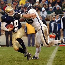 Brigham Young University Brady Poppinga  sacks University of Notre Dame qb Brady Quinn in action Nov 15th, 2003 in South Bend, Indiana.   (Submission date: 11/15/2003)