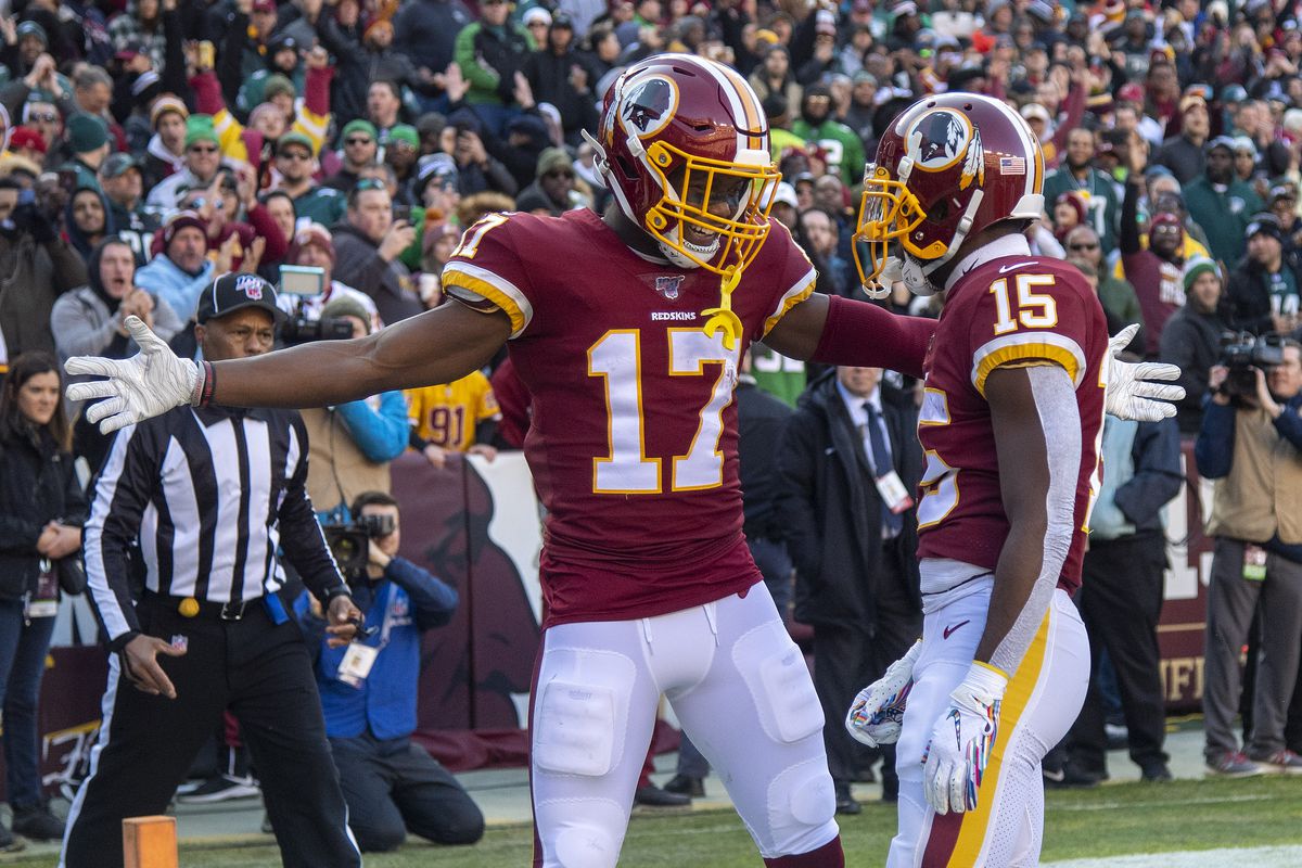 Washington Redskins wide receiver Steven Sims is congratulated by wide receiver Terry McLaurin after scoring a touchdown against the Philadelphia Eagles during the first half at FedExField