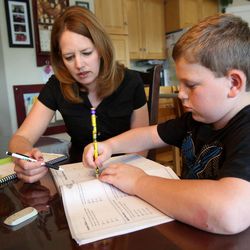 Kristin Eberting helps her son Nathan with his homework at their home in Alpine on Thursday, Oct. 3, 2013. Nathan has dyslexia.