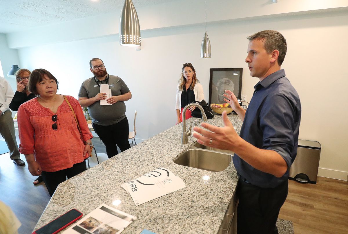 Ivan Carroll, GIV Development, talks about apartments during an opening event for a net-zero emissions apartment building called Project Open in Salt Lake City on Tuesday, June 12, 2018. Its developers say it's the tallest net-zero apartment building in U