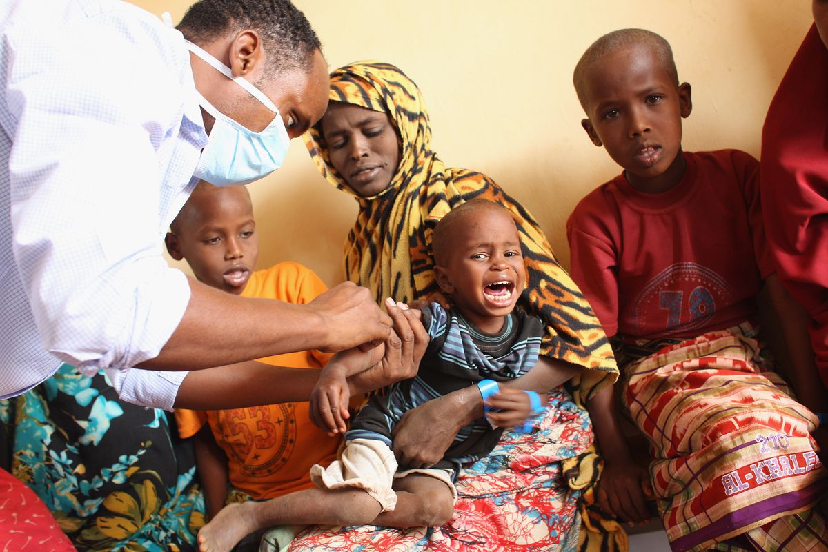 Children get vaccinations in a refugee settlement in Dadaab, Kenya.
