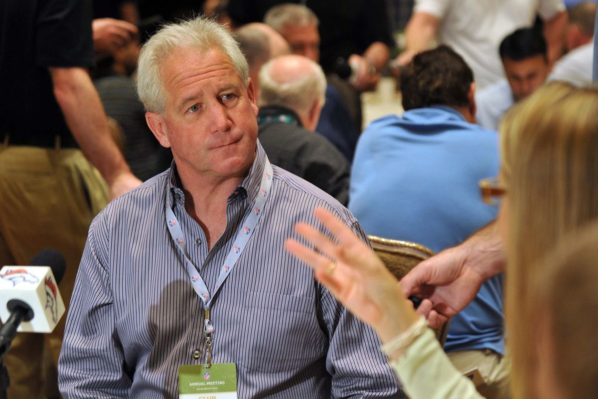 March 27,  2012; Palm Beach, FL, USA; Denver Broncos coach John Fox (left) fields questions from a reporter during the AFC head coaches media breakfast at the Breakers Hotel. Mandatory Credit: Steve Mitchell-US PRESSWIRE