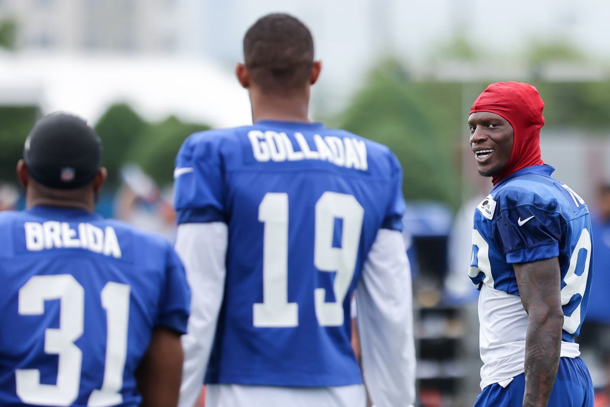New York Giants wide receiver Kadarius Toney (89) talks with wide receiver Kenny Golladay (19) and running back Matt Breida (31) during training camp at Quest Diagnostics Training Facility.