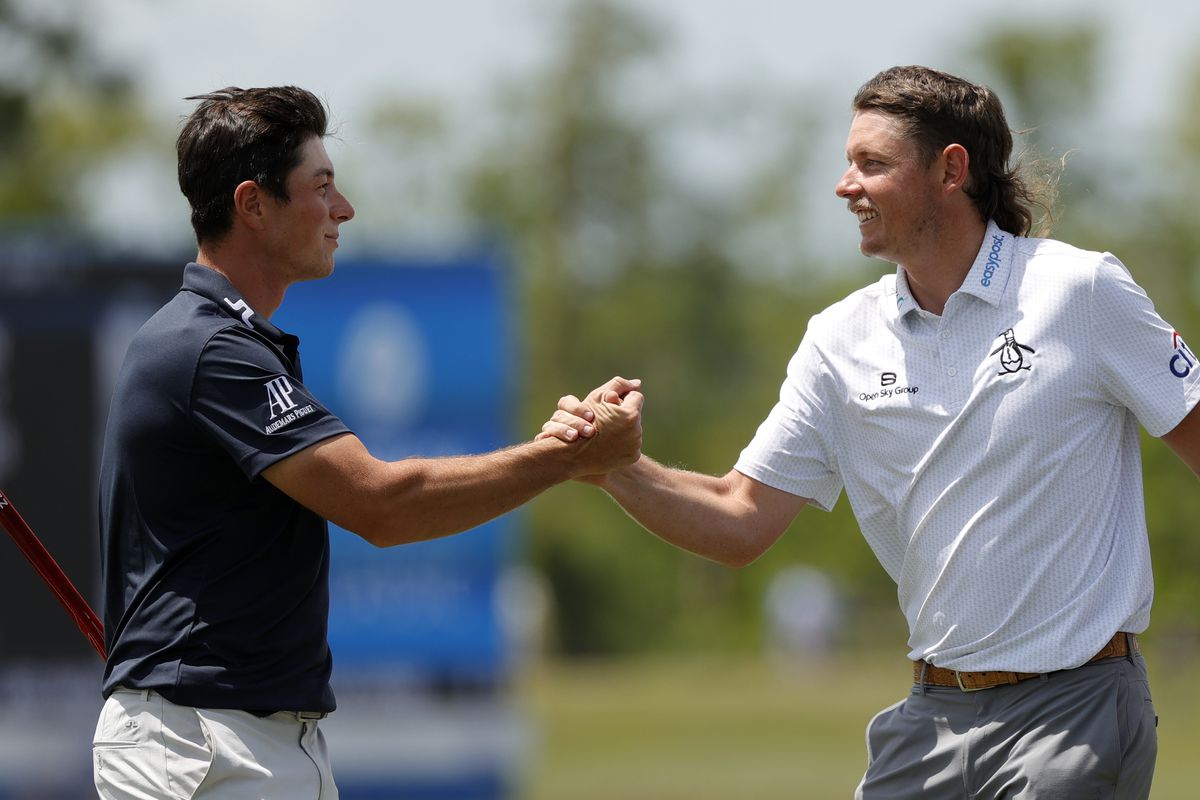 Cameron Smtih of Australia Viktor Hovland of Norway shake hands on the ninth green during the first round of the Zurich Classic of New Orleans at TPC Louisiana on April 21, 2022 in Avondale, Louisiana.