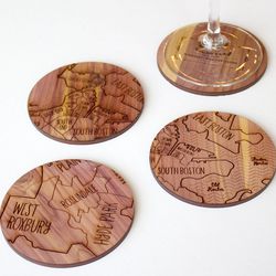 Neighborwoods makes Boston coasters from aromatic cedar for <a href="http://neighborwoodmaps.com/collections/boston/products/boston-coasters">$36</a>.