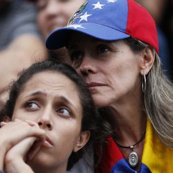Anti-government demonstrators attend a vigil in honor of those who have been killed during clashes between security forces and demonstrators in Caracas, Venezuela, Monday, July 31, 2017. Many analysts believe Sunday's vote for a newly elected assembly that will rewrite Venezuela’s constitution will catalyze yet more disturbances in a country that has seen four months of street protests in which at least 125 people have died. (AP Photo/Ariana Cubillos)