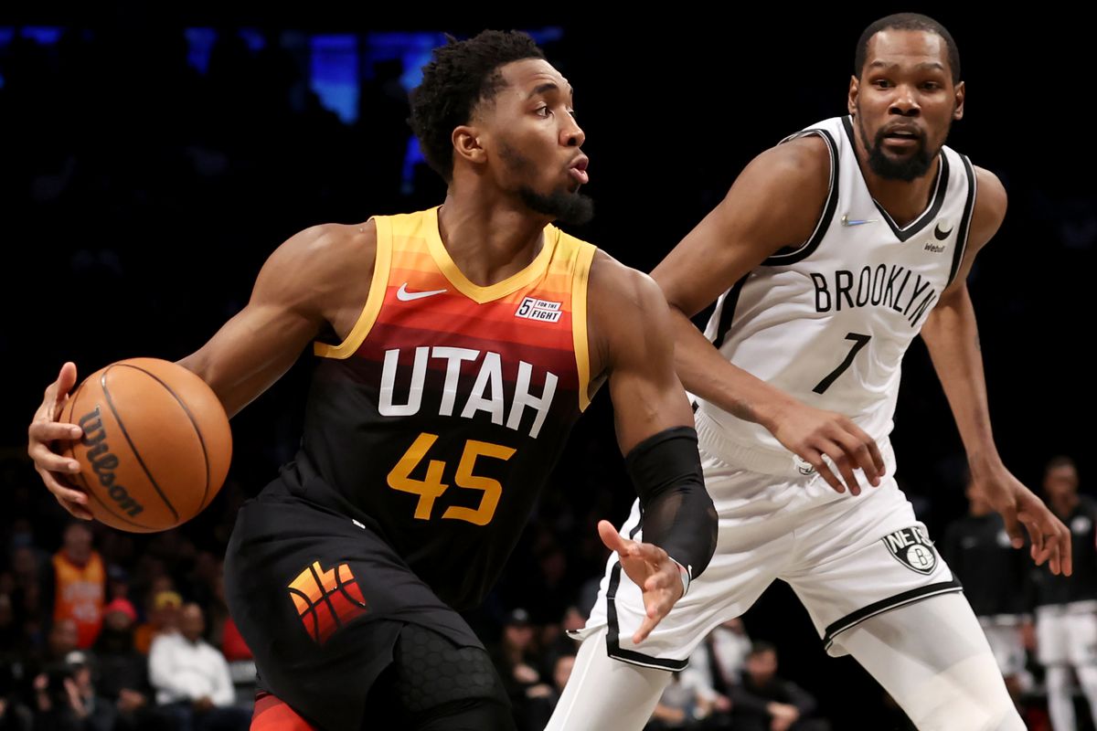 Utah Jazz guard Donovan Mitchell (45) drives to the basket against Brooklyn Nets forward Kevin Durant (7) during the fourth quarter at Barclays Center.