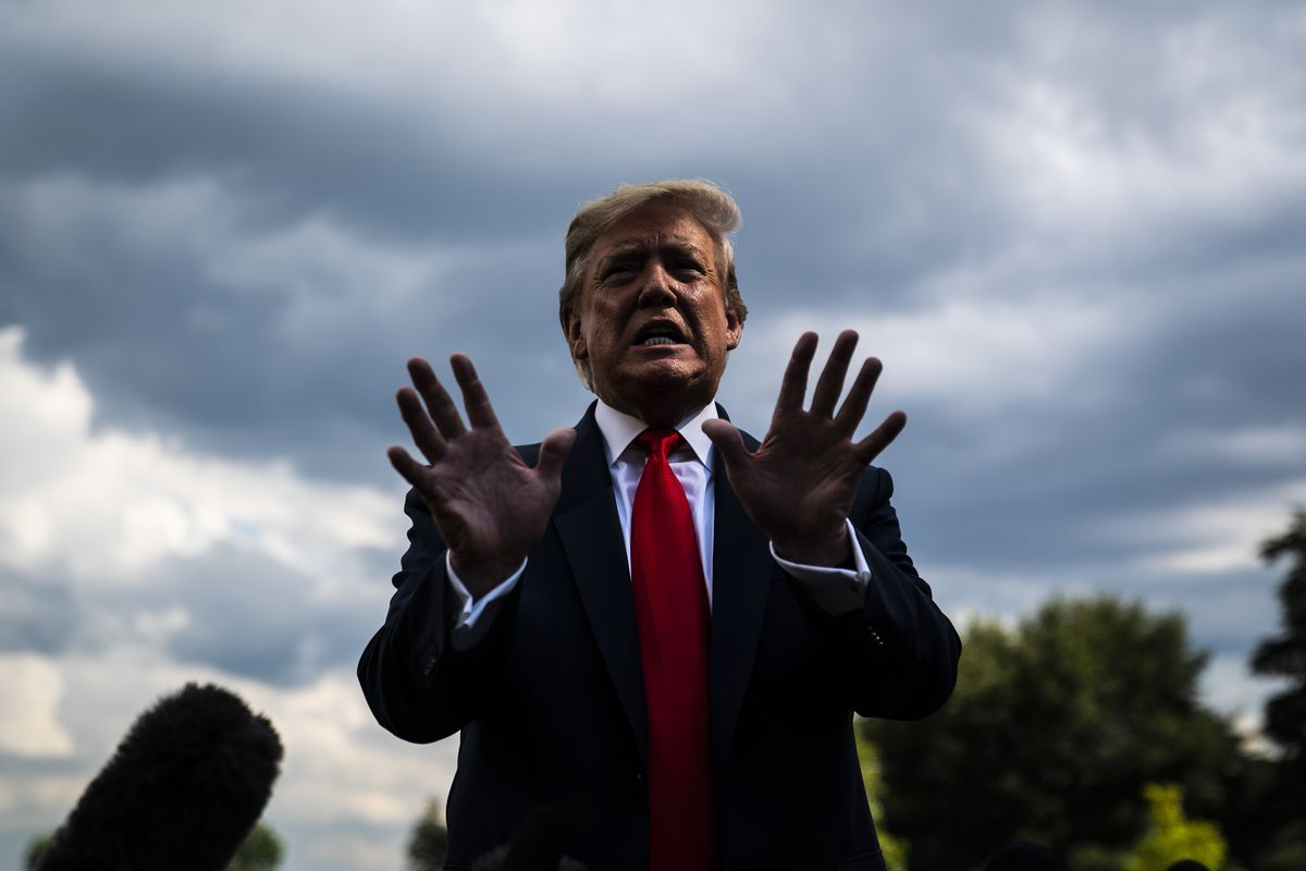 President Trump talks to reporters on the day of the former special counsel Robert Mueller testimony on Capitol Hill, on July 24, 2019.