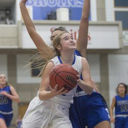 Fremont's Halle Duft attempts a shot while guarded by Bingham's Jada Suguturaga during Fremont's 61-47 victory against Bingham in the Class 6A state championship game at Salt Lake Community College in Taylorsville on Saturday, Feb. 24, 2018.