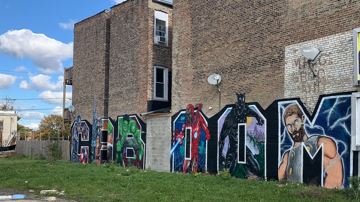 Comic book superheroes burst from the word “CABOOM,” is a play on words: CAB is the Chicago graffiti art crew that completed the mural on the West Side, and “KABOOM,” in this case the figurative sound of the artistic explosion they created.