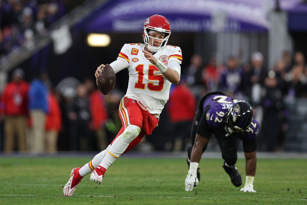 Patrick Mahomes of the Kansas City Chiefs scrambles under pressure from Justin Madubuike #92 of the Baltimore Ravens during the second quarter in the AFC Championship Game at M&amp;T Bank Stadium on January 28, 2024 in Baltimore, Maryland.