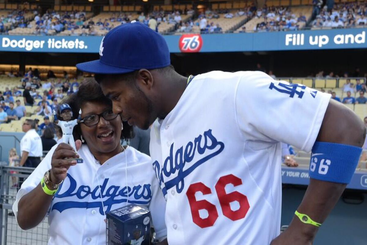 Yasiel Puig's mom, Maritza, threw out the ceremonial first pitch on his bobblehead night.