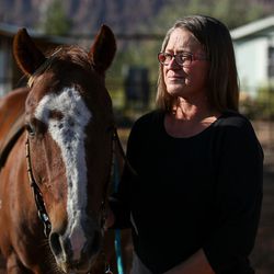 Molly McClish poses for a photo at Red Rock Ranch, where her daughter, Lily, used to ride horses near their home in Moab on Friday, Sept. 29, 2017.