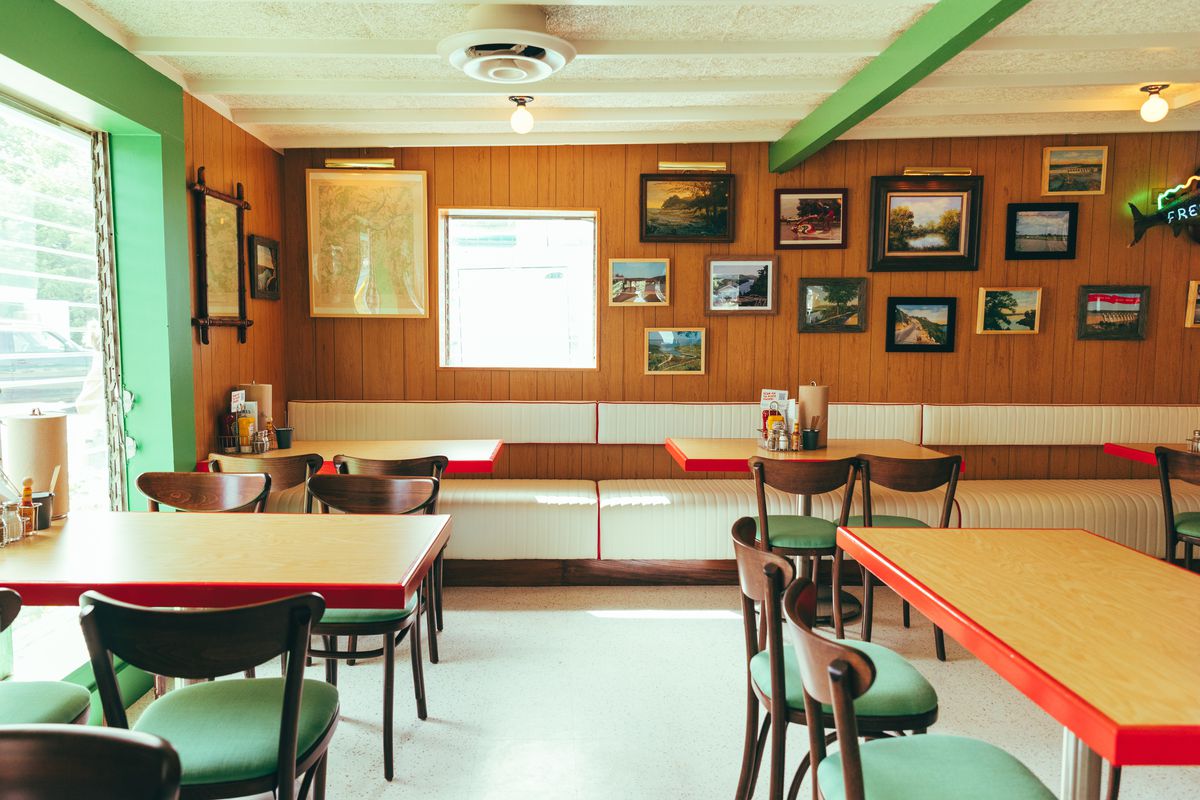 Wood tables, booths, and walls with memorabilia