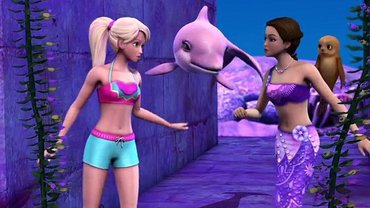 Barbie as Merliah, in a surf swim suit, arguing with Kylie, a brunette who now has a purple mermaid tail. They are underwater.