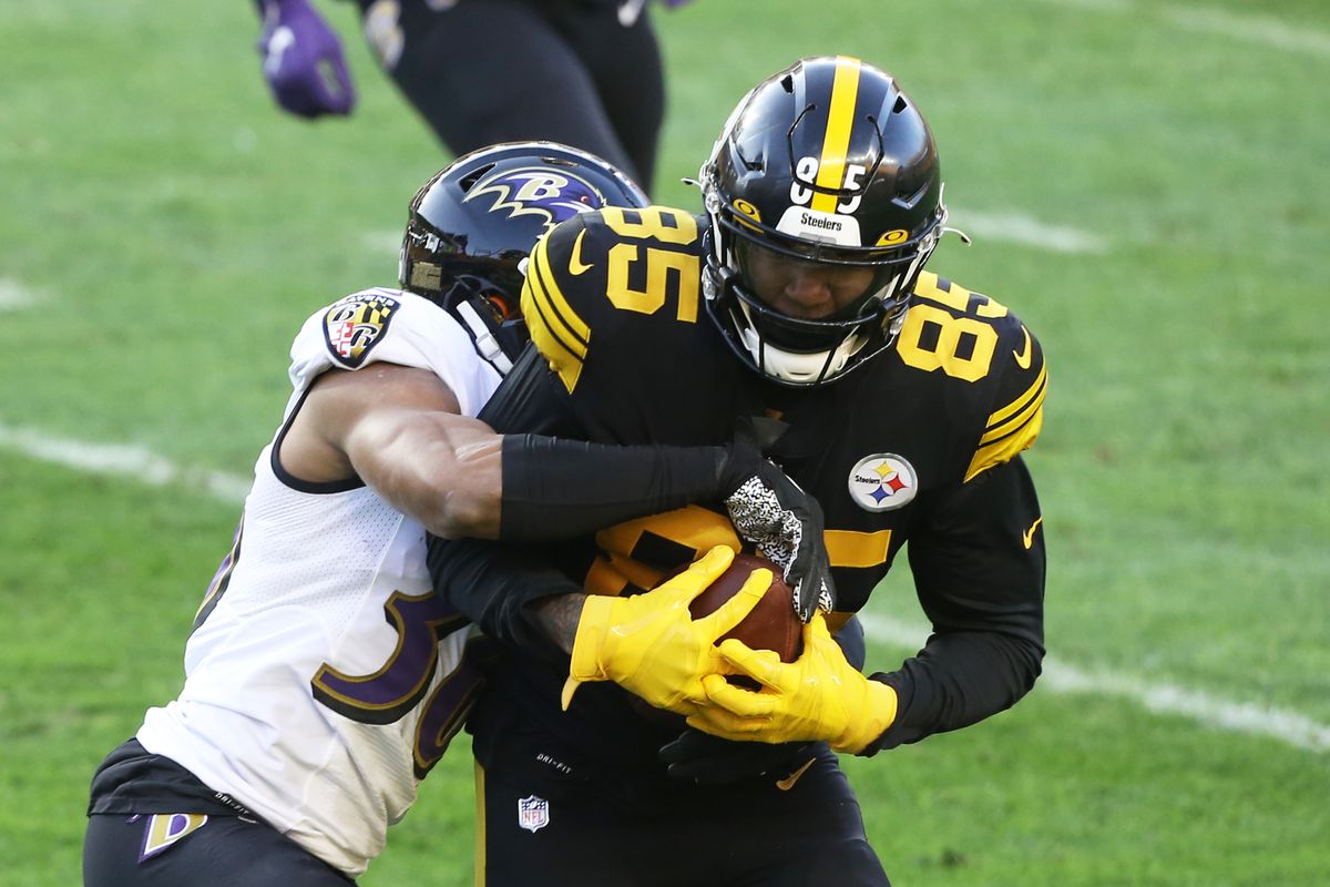 Baltimore Ravens strong safety Chuck Clark (36) tackles Pittsburgh Steelers tight end Eric Ebron (85) after a pass reception during the first quarter at Heinz Field.