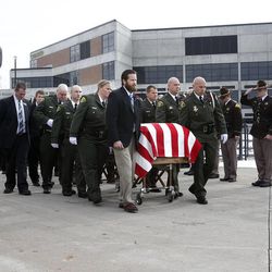 Pallbearers escort the casket carrying Utah County Sheriff's Sgt. Cory Wride after the funeral service at Utah Valley University in Orem on Wednesday, Feb. 5, 2014. Wride was killed in the line of duty on Thursday while conducting what initially appeared to be a routine traffic stop. Wride was a deputy with the sheriff's office for 19 years and leaves behind a wife, five children and eight grandchildren.