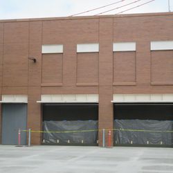 Garage door bays, on the west side of the broadcast building -