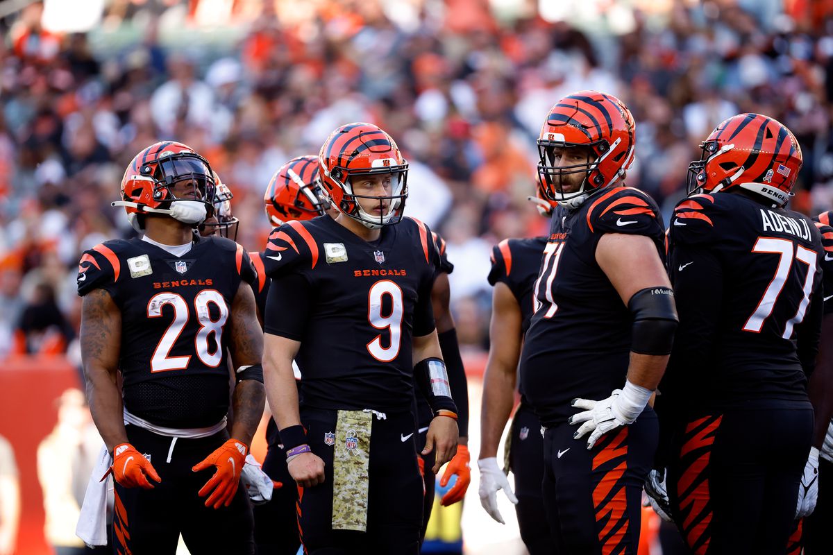 Joe Burrow #9 of the Cincinnati Bengals waits to call a play in the huddle during the game against the Cleveland Browns at Paul Brown Stadium on November 7, 2021 in Cincinnati, Ohio.