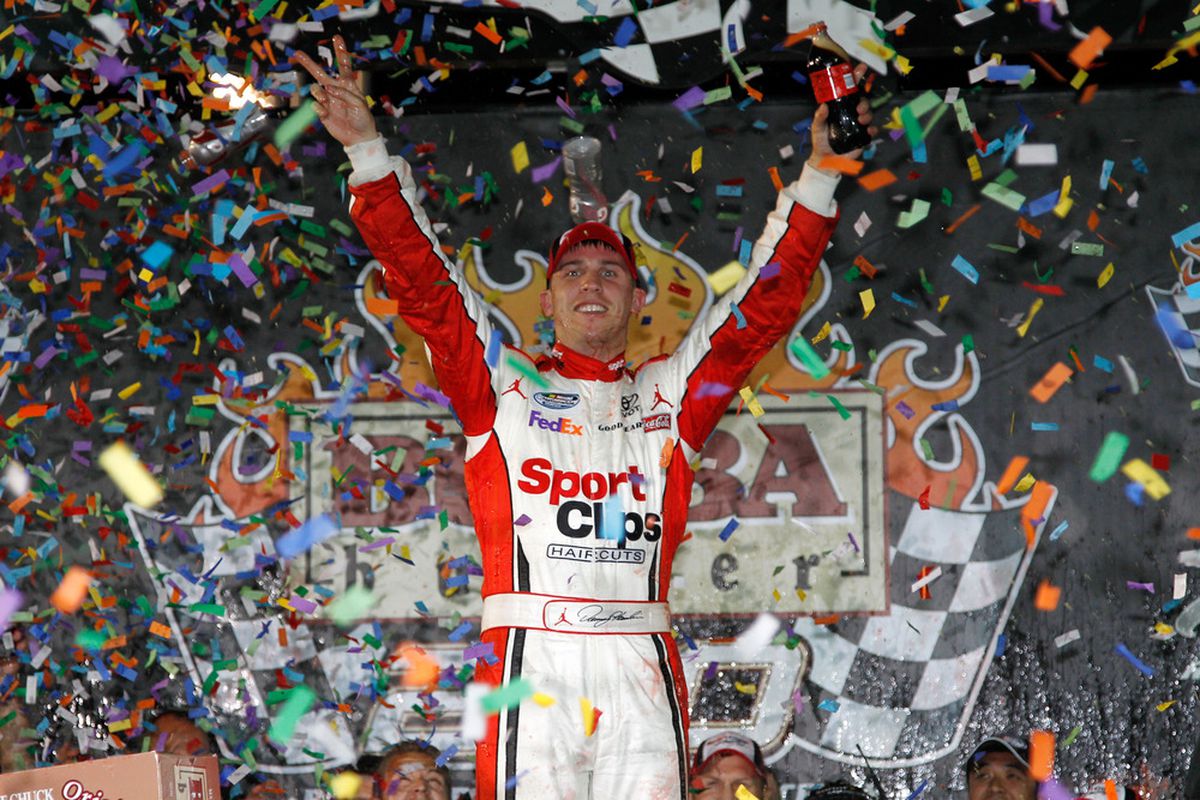 Denny Hamlin celebrates in victory lane after winning the NASCAR Nationwide Series Bubba Burger 250 at Richmond International Raceway.