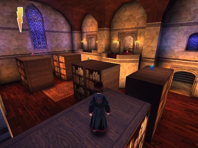 harry potter standing on a bookcase