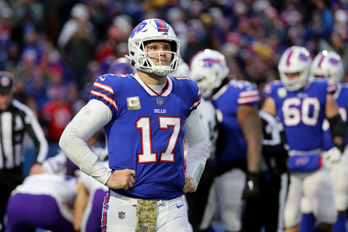 Bills quarterback Josh Allen walks of the field after fumbling the snap that turned into a Vikings touchdown.