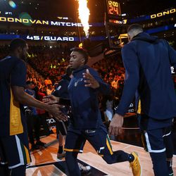 Utah Jazz guard Donovan Mitchell (45) enters the court before the game against the Cleveland Cavaliers at Vivint Arena in Salt Lake City on Saturday, Dec. 30, 2017.