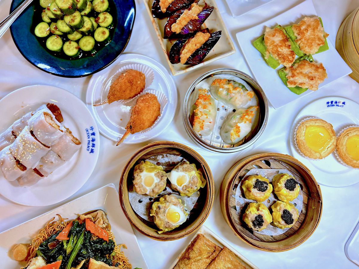 fried crab claws, har gow, egg tarts, stuffed rice noodles and more on a table at Ocean Palace.