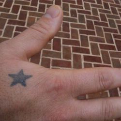 "I worked at Eleven Madison Park in 2002, where I was on the hot app station. One evening, I was sautÃ©ing foie gras and the butter in the pan splashed up on me. Later that night, I took $20 to the tattoo parlor to get this star to remind myself to n