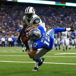 Aug 9, 2013; Detroit, MI, USA; Detroit Lions wide receiver Matt Willis (12) catches a pass in the end zone for a touchdown while being defended by New York Jets running back Chad Spann (30) in the second quarter of a preseason game at Ford Field.