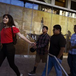 Dachuneeh Martin, left, a ninth-grader from Whitehorse High School in Montezuma Creek, runs to the door of the theater in anticipation of seeing "Hamilton" at the Eccles Theater in Salt Lake City on Friday, May 4, 2018. More than 2,000 high school students attended the matinee showing and performed their own "Hamilton"-inspired performances followed by a Q&A with the "Hamilton" cast.