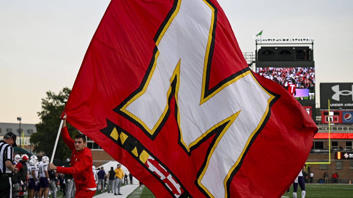 A University of Maryland Terrapins flag is brought across the field after a touchdown during the Northwestern Wildcats game versus the Maryland Terrapins on October 22, 2022 at SECU Stadium in College Park, MD.