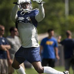 Running back Jamaal Williams makes a catch during a BYU football practice at BYU's practice fields Thursday, Aug. 14, 2014.