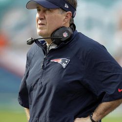 New England Patriots head coach Bill Belichick looks during the second half of an NFL football game against the Miami Dolphins, Sunday, Dec. 15, 2013, in Miami Gardens, Fla. The Dolphins defeated the Patriots 24-20.  