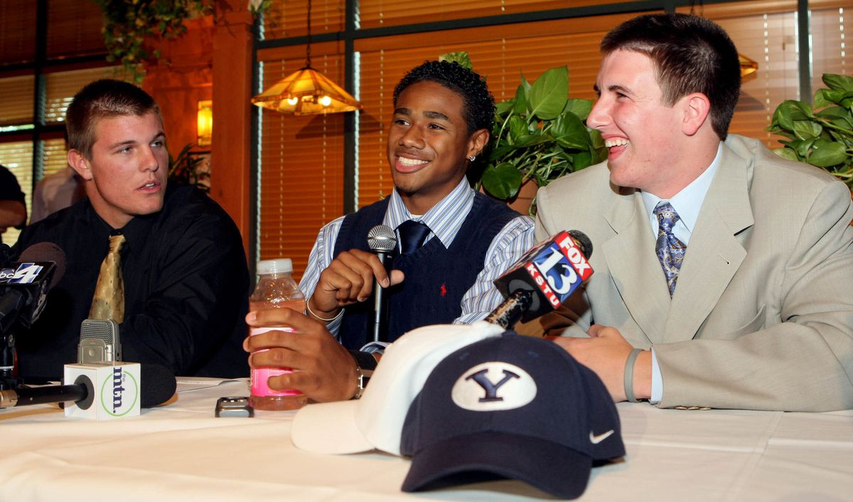 Prep quarterback Jake Heaps, right, announces that he will sign with BYU at a press conference at Iggy's Sports Bar and Grill in Salt Lake City on June 4, 2009. Also announcing is junior receiver Ross Apo, center, from The Oakridge School in Arlington, Te