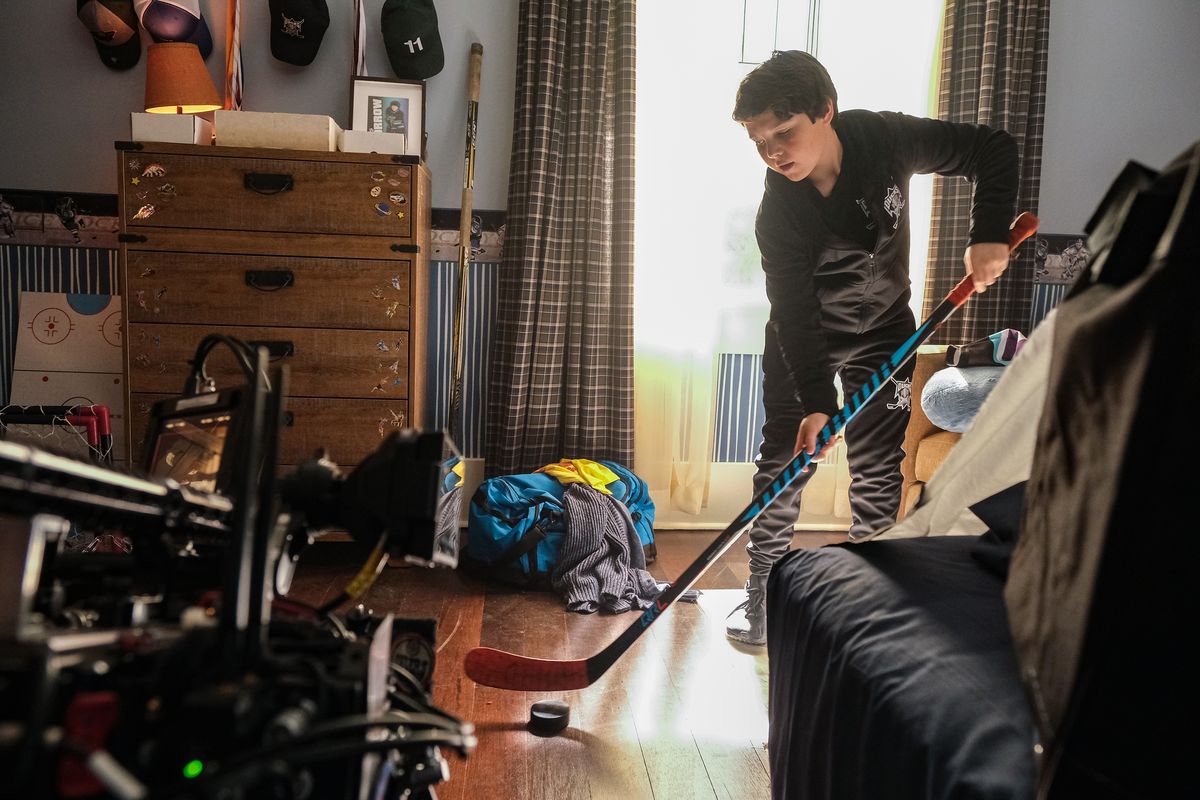 Brady Noon practices hockey in his living room in Mighty Ducks: Game Changers