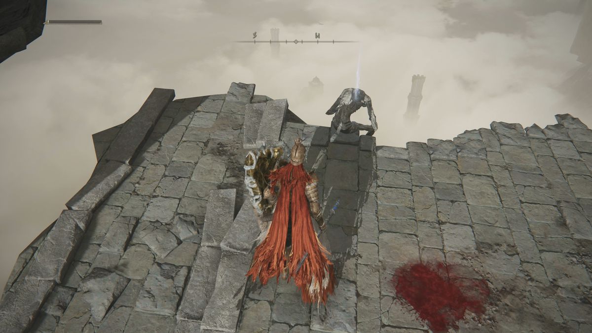 Un joueur de l'Elden Ring s'approche d'un cadavre sur un pont cassé avec une clé de mot en pierre enterrée dans les quatre clochers