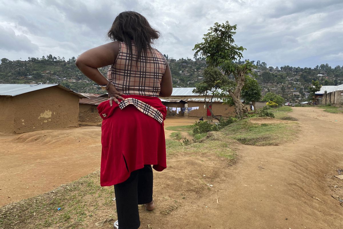 Shekinah stands near her home in Beni, eastern Congo on Thursday, March 18, 2021.