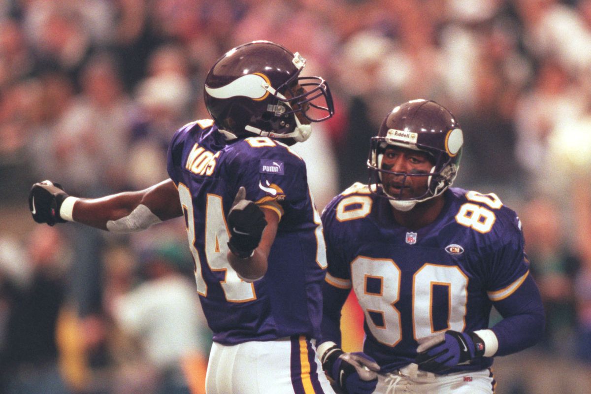 Minneapolis, MN 10/3/99 Vikings vs. Tampa Bay Buccaneers — Randy Moss, left, celebrates his second touchdown of the day with Cris Carter, right, putting the Vikings ahead of Tampa Bay 14-0 in the first quarter.