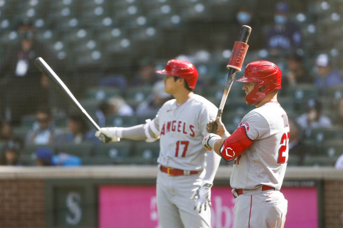 Los Angeles Angels center fielder Mike Trout and designated hitter Shohei Ohtani stand in the on deck circle during a seventh inning pitching change by the Seattle Mariners at T-Mobile Park.