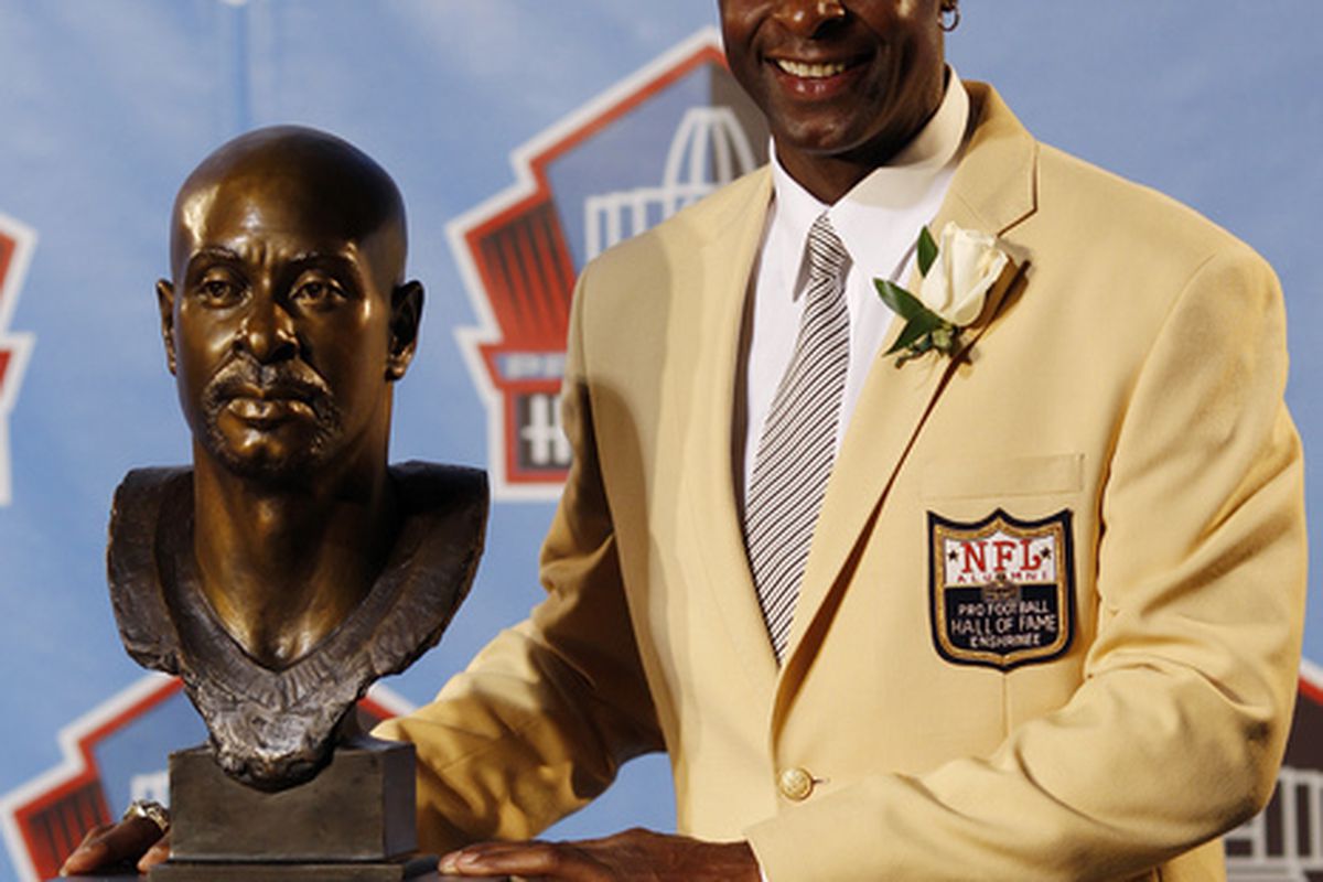 CANTON OH - AUGUST 7: Jerry Rice poses with his bust during the 2010 Pro Football Hall of Fame Enshrinement Ceremony at the Pro Football Hall of Fame Field at Fawcett Stadium on August 7 2010 in Canton Ohio. (Photo by Joe Robbins/Getty Images)