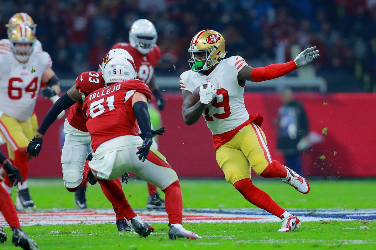 Deebo Samuel #19 of the San Francisco 49ers carries the ball against the Arizona Cardinals during the first quarter at Estadio Azteca on November 21, 2022 in Mexico City, Mexico.
