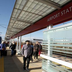 Passengers ride the new airport TRAX line on its first public run in Salt Lake City on Sunday, April 14, 2013.